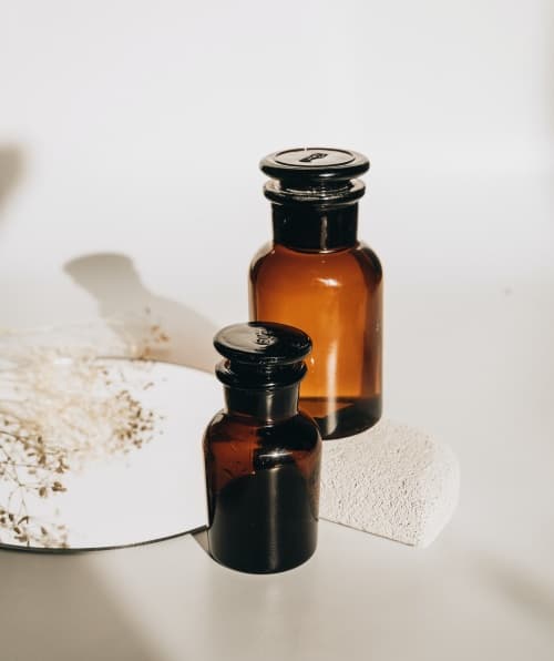 Two empty, brown bottles